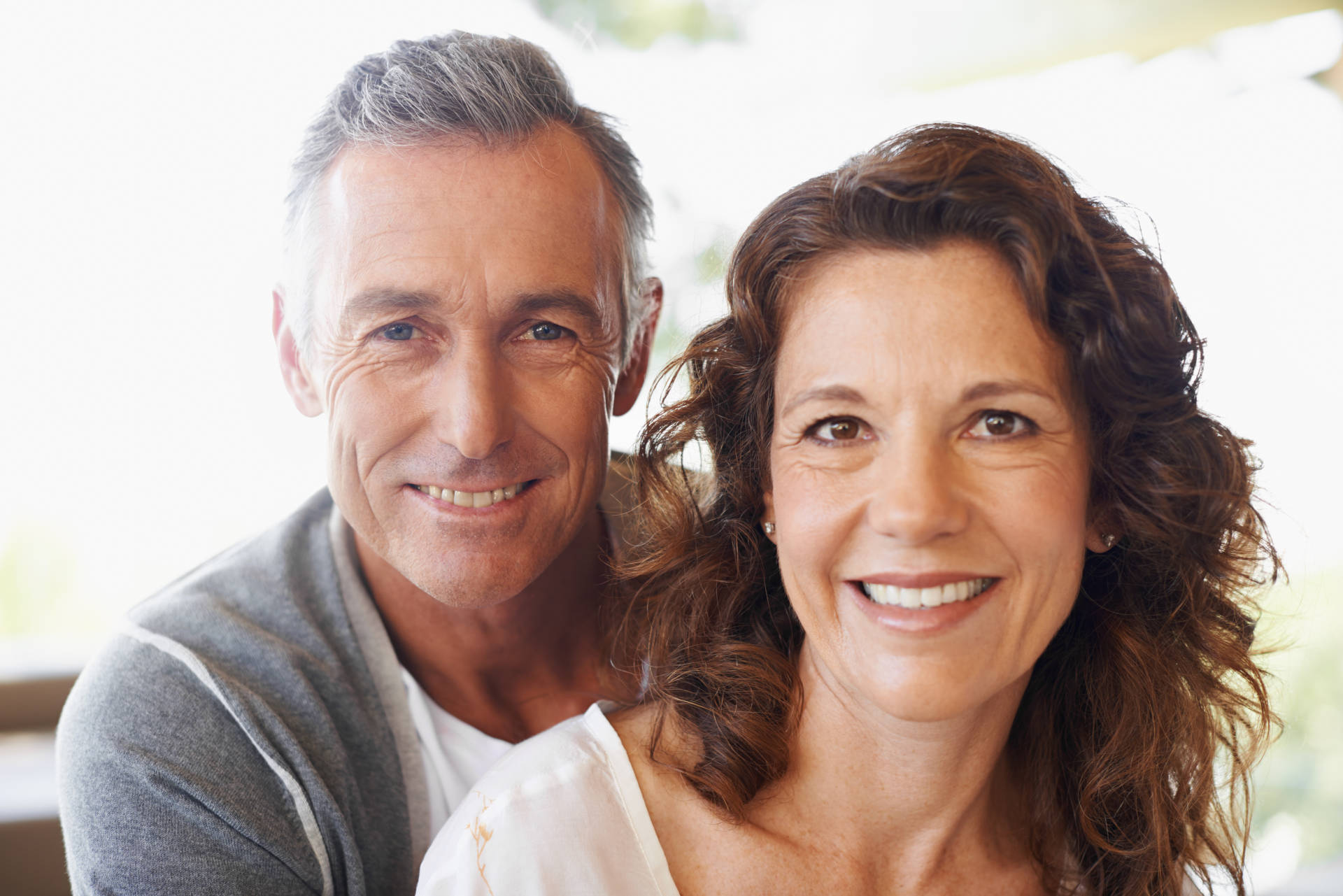 A smiling middle-aged couple