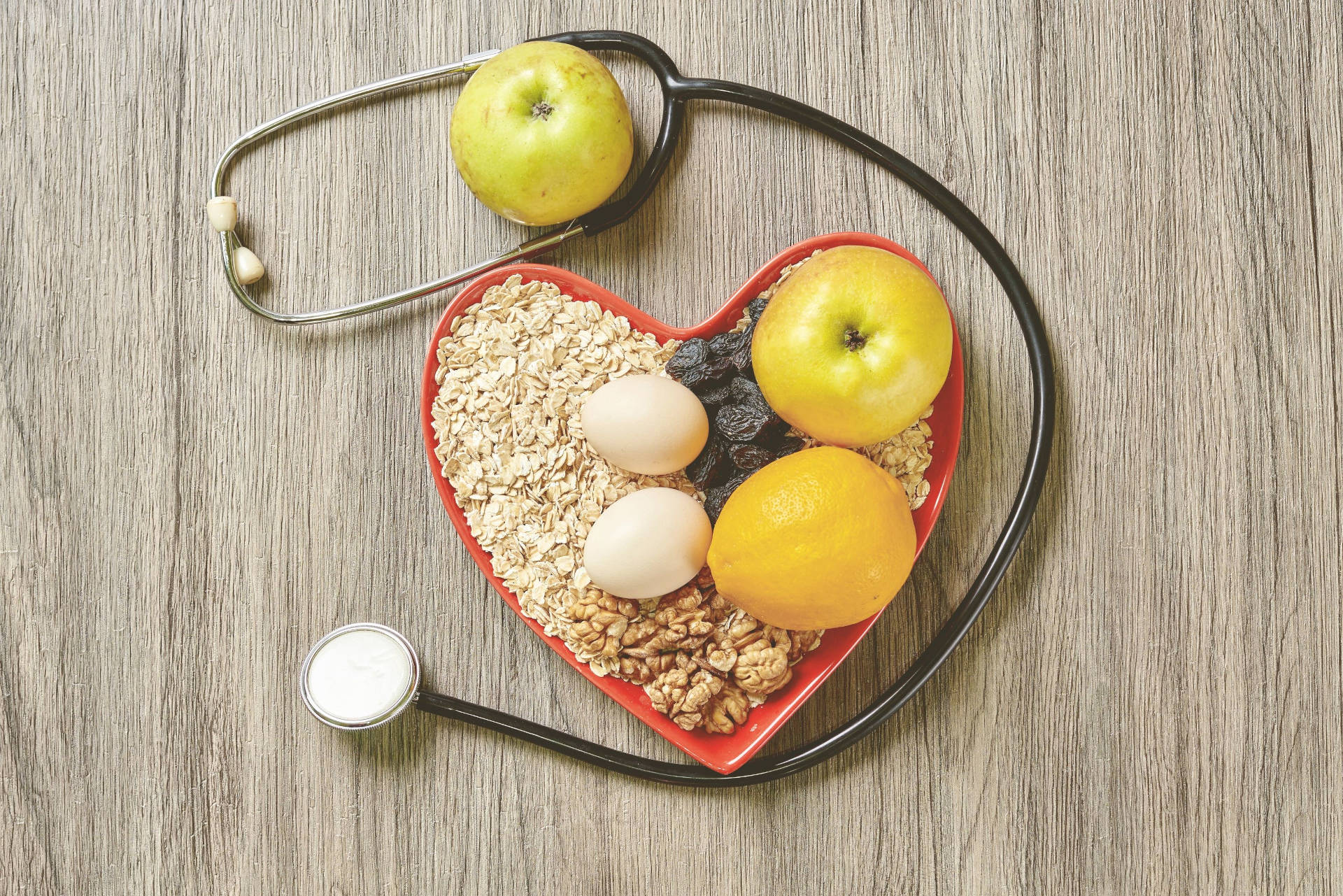 A heart and selection of low-cholesterol foods. 